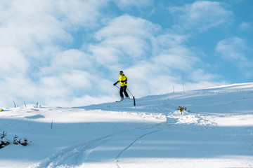 Fototapeta na wymiar white snow near sportsman skiing in wintertime