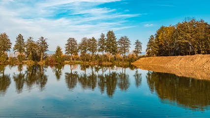 Beautiful autumn or indian summer view with reflections near Steinkirchen, Danube, Bavaria, Germany