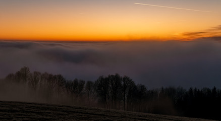 Beautiful sunset above the clouds near Kostenz, Bavarian forest, Bavaria, Germany