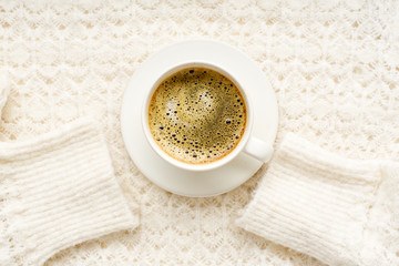Flatlay with knitted sweater and a cup of coffee