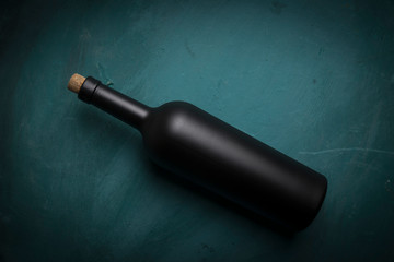 Wine tasting experience in the rustic cellar and wine bar: red wine glass and collection of...