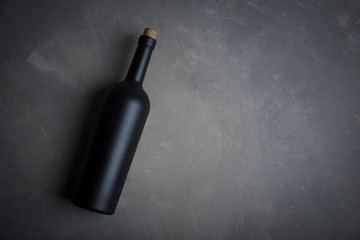 Wine tasting experience in the rustic cellar and wine bar: red wine glass and collection of...