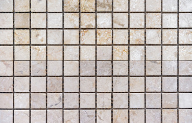 Ceramic mosaic tiles with brown and beige squares.