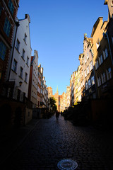 Morning sun falling in the shadows of Mariaka street, in Gdańsk (Danzig in German) a port city on...