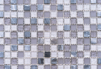 Ceramic mosaic tiles with gray and white squares.