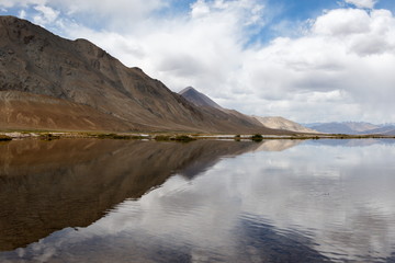 Central Asia. Kyrgyzstan. An unnamed high-mountain lake near the Pamir tract on the border with Tajikistan.