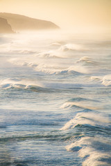 Portrait ocean waves during sunrise