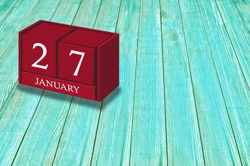 January 27th, Day 27 of january month, Red calendar on workplace green wood, Empty space for text, Copy space right
