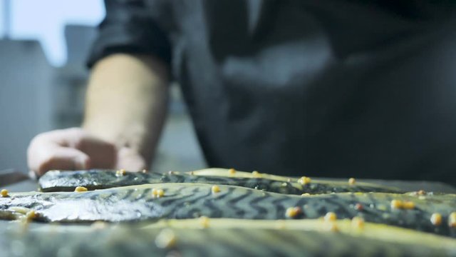 Mackerel fish is prepared in a combi steamer, fish beer snacks, crispy fish, cooking, a cook in the kitchen, a seafood dish, Asian cuisine