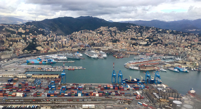 Drone view Aerial view panoramic view of Genoa in Italy with port, cruise ships, container and cargo ships and skyline