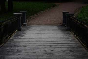 evening view of the wooden bridge in the park