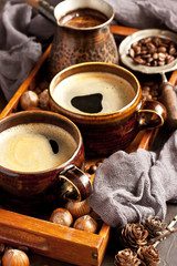 Coffee cup on  wooden tray