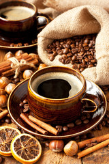 Ceramic cup with coffee on dark background, selective focus