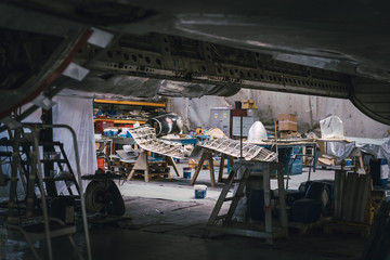 Industrial workshop, tools and parts gather on tables