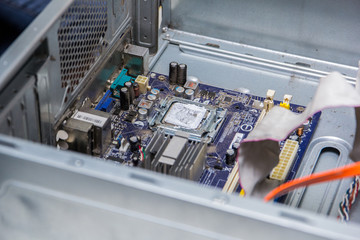 motherboard of a computer with processor on a repair table.