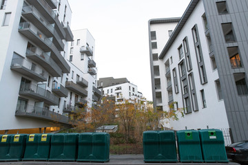 Waste bins in a city centre of Massy in France in front of a building
