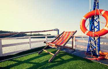 Fototapeta na wymiar sunbeds on the cruise ship in midday.