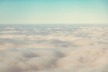 Fototapeta na wymiar bird eye view of cloud and sun ray light shot from airplane window