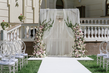 A large rectangular arch adorns the area for the marriage ceremony