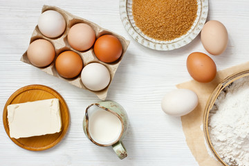 Ingredients for baking on  wooden table, top view