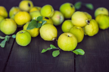 Japanese quince fruit on the table close-up. harvest the fruits of Japanese quince.