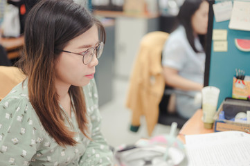 Portrait of a asian woman using computer in office,Concentrated at work