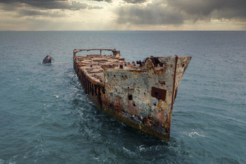 The infamous Sapona concrete ship sits wrecked in the shallow waters of the Caribbean Sea near the...