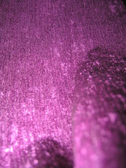 shiny fabric draped with macroscheiki and bokeh