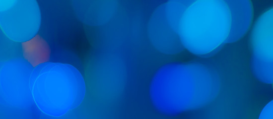 Abstract Bokeh Blue and green background of defocused glittering lights. Christmas, Party, New Year, luxurious background pattern concept. banner.