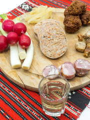 traditional christmas plateau of various pork appetizers on traditional red cloth 