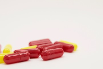 Yellow and red capsules isolated
