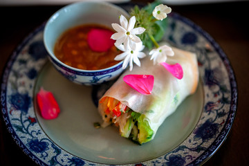 Beautifully decorated veggie wrapped on a china dish