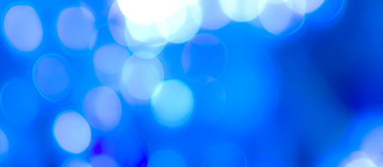 Abstract Bokeh Blue and green background of defocused glittering lights. Christmas, Party, New Year, luxurious background pattern concept. banner.