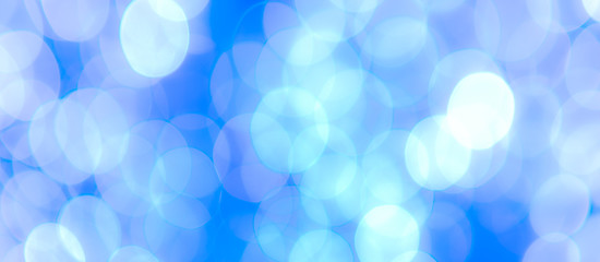 Abstract Bokeh Blue and green background of defocused glittering lights. Christmas, Party, New Year, luxurious background pattern concept. banner.