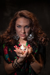 Fortune teller with a magic stone. Romantic magic. Palmistry. Clairvoyance