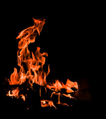 Flames of fire on a black background. The mystery of fire.