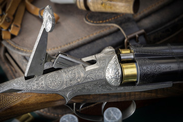 hunting rifle with an unusual reloading system and beautiful engraving