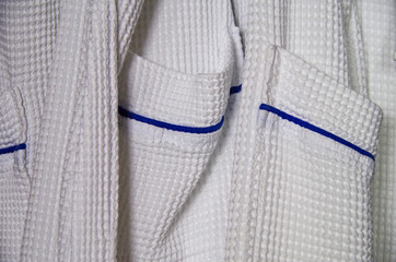 Detail and closeup of pique bathrobe with blue lining onboard luxury cruise ship liner