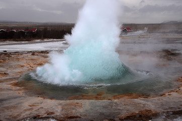 Blurred. The eruption of the Strokkur geyser in the southwestern part of Iceland in a geothermal area near the river Hvitau