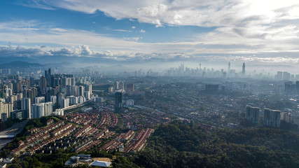 Beautiful aerial view of downtown at Kuala Lumpur, Malaysia skyline with urban skyscrapers during cloudy sunrise