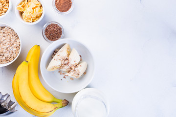 Ingredients for Banana Smoothie on a white background. Healthy eating concept.