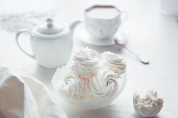 Obraz na płótnie Canvas vanilla homemade marshmallows and cup of cocoa, white color