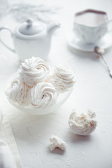 Obraz na płótnie Canvas vanilla homemade marshmallows and cup of cocoa, white color
