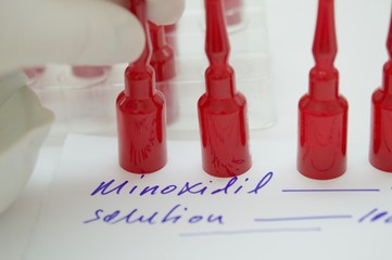 Ampoules for hair loss and prescription of minoxidil