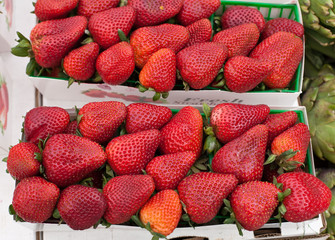 Boxes of ripe strawberries at farmers market