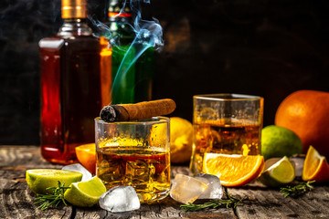 Elite drink for masculine relaxation. alcoholism, alcohol addiction and people concept - male alcoholic with bottle and glass drinking whiskey at night.Businessman drinks whiskey