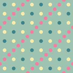 Vector seamless pattern pastel rainbow with yellow, pink, green polka dots and green background.