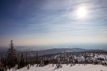 sun above bavarian forest in winter