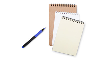 Open notebooks and pen lie on a white isolated background. Business background. Flat layout, mockup. Planning, creative.