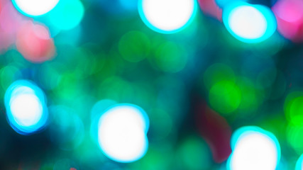 Blurred abstract Christmas lights garland background. A modern material for key visual design.